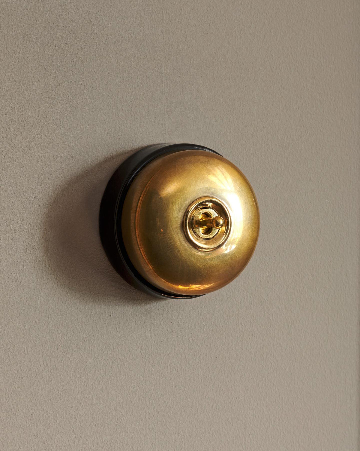 The Dolly Toggle Switch - Heirloom Brass, Black Base, Retract to Centre TEST