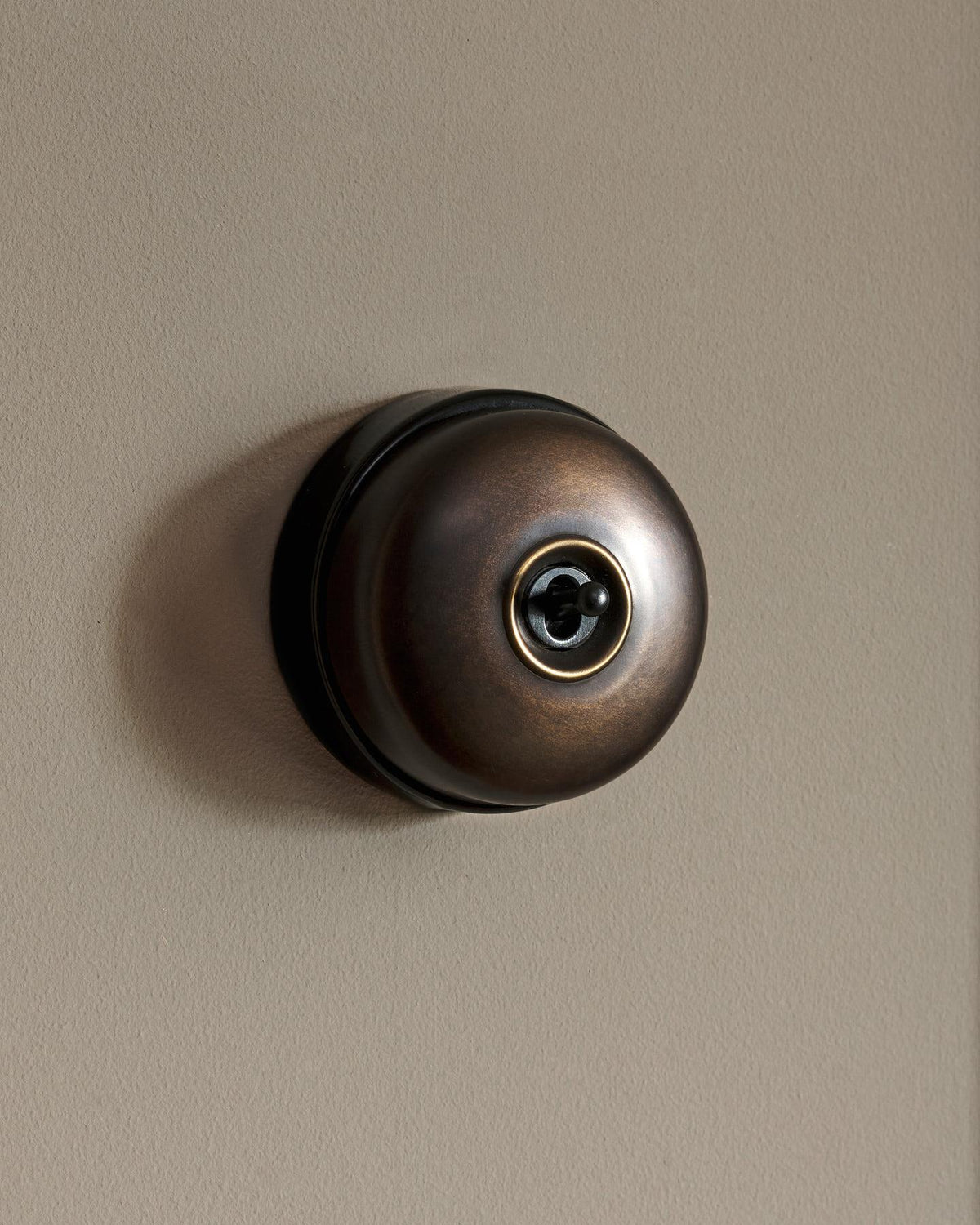 The Dolly Toggle Switch - Oxidised Brass, Black Base, Retract to Centre TEST