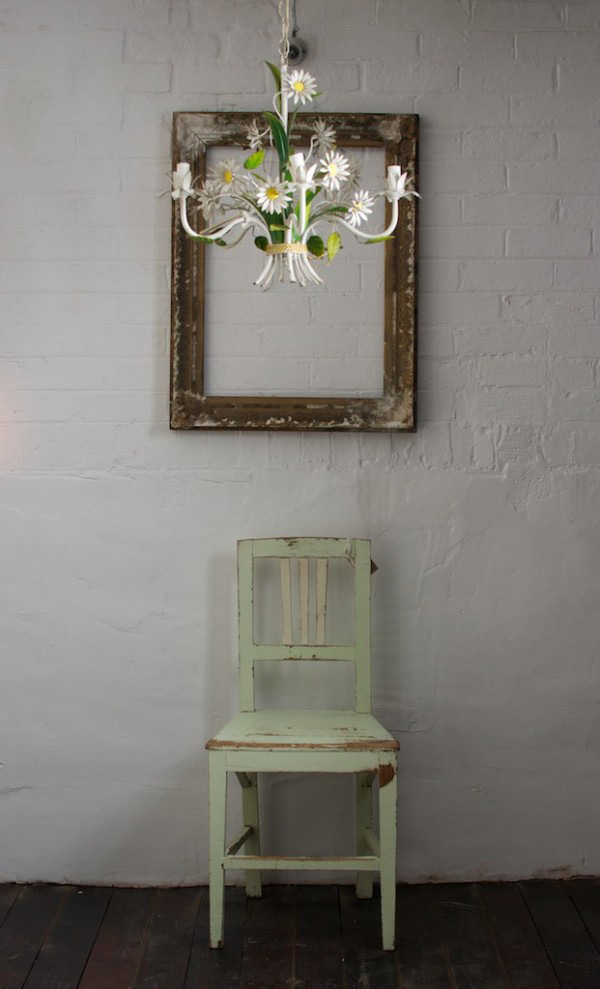 light green chair and daisy chandalier