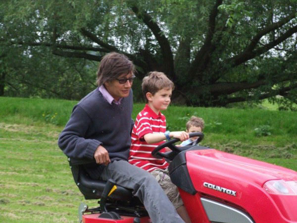 deVOL-kitchens-blog-family-Paul-OLeory-O'Leory-Cotes Mill-son-driving-lawn-mower-fun