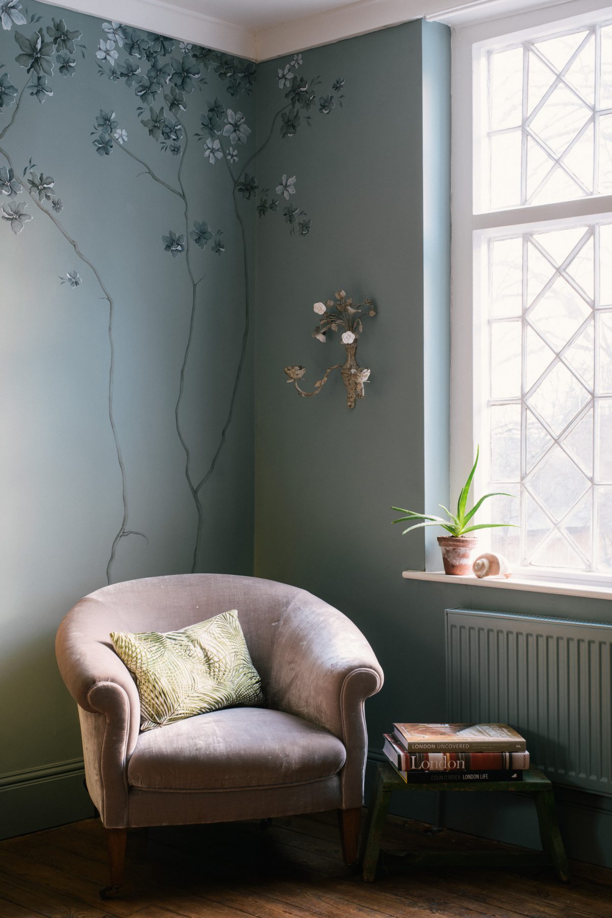 The branches I painted on this wall were very subtle and fitted so nicely behind this old velvet chair. 