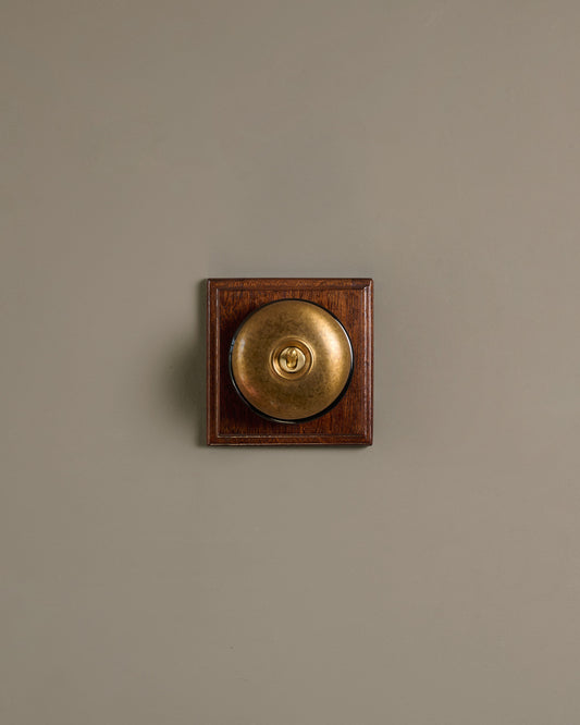The Dolly Toggle Switch (1 Gang & Mahogany Finish Pattress) - Aged Brass with Black Base.