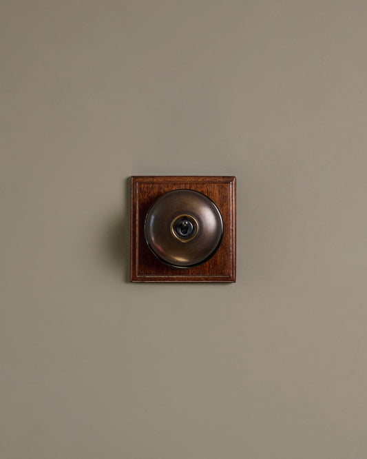 The Dolly Toggle Switch (1 Gang & Mahogany Finish Pattress) - Oxidised Brass with Black Base.