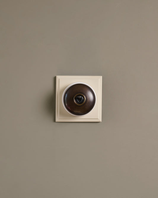The Dolly Toggle Switch (1 Gang & Primed Maple Pattress) - Oxidised Brass with White Base.