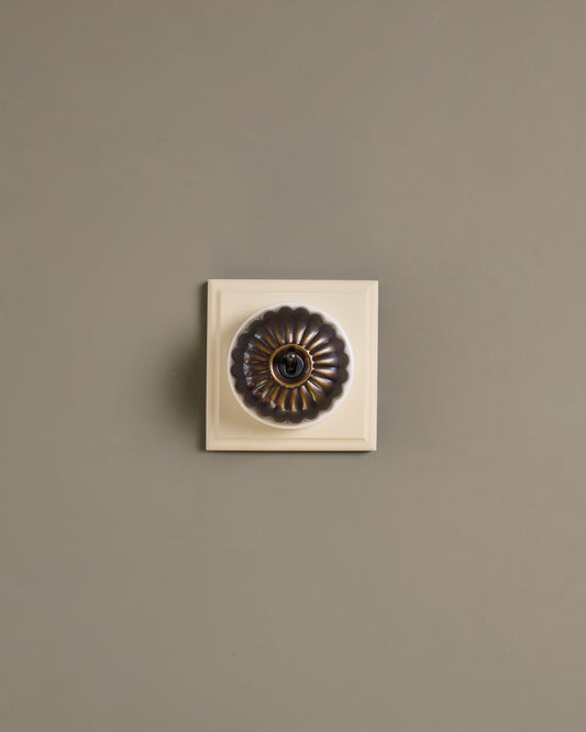 The Jelly Toggle Switch (1 Gang & Primed Maple Pattress) - Oxidised Brass with White Base.