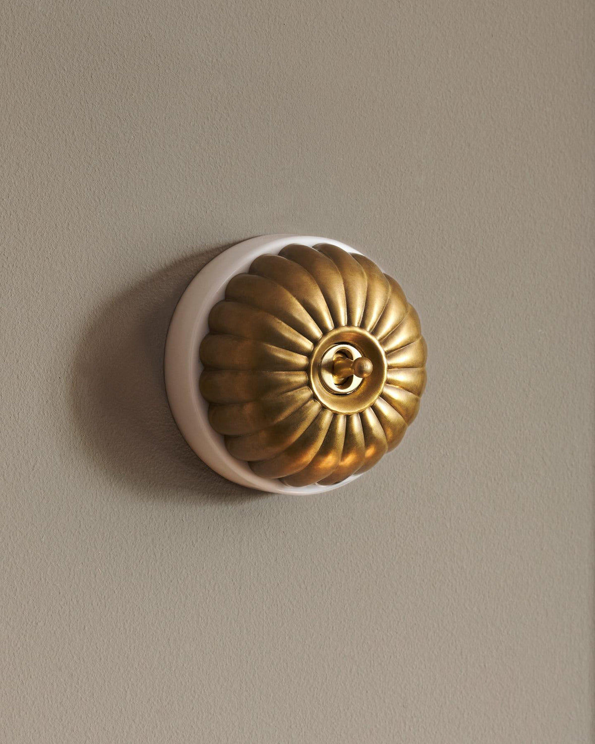 The Jelly Toggle Switch - Aged Brass, White Base, Retract to Centre TEST