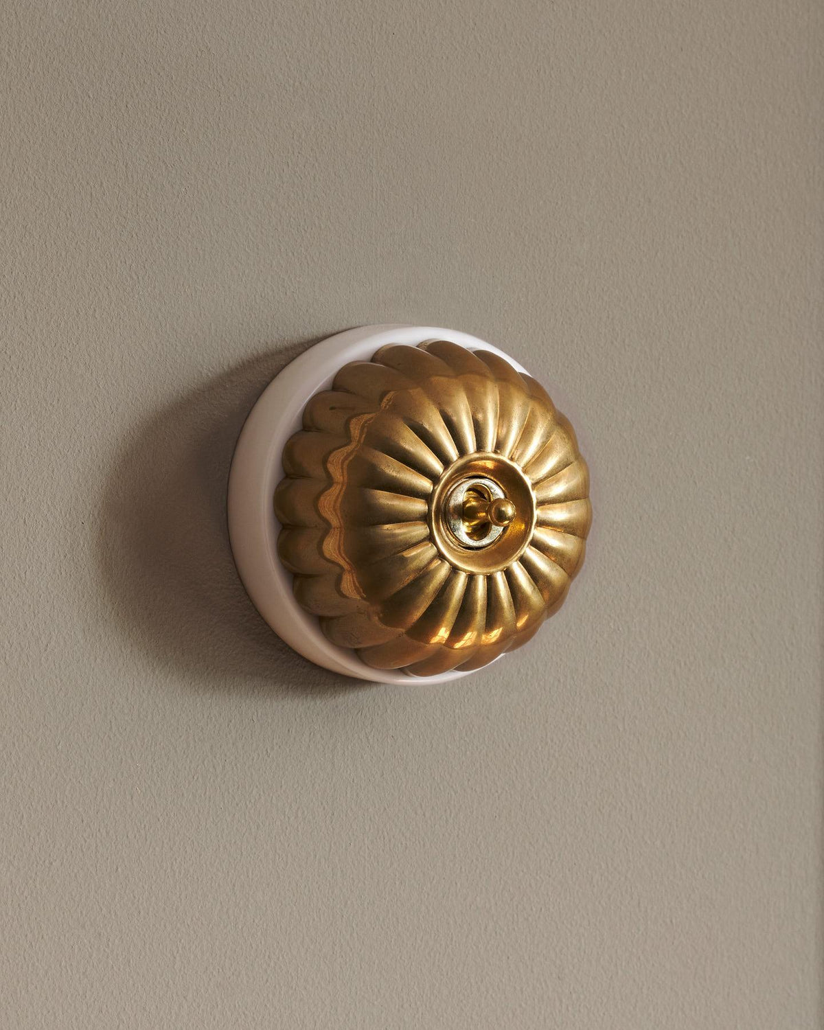 The Jelly Toggle Switch - Heirloom Brass, White Base, Retract to Centre TEST