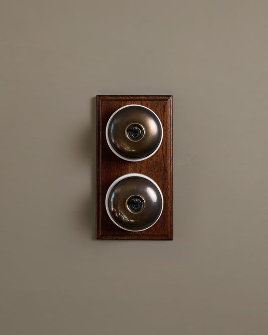 The Dolly Toggle Switch (2 Gang & Mahogany Finish Pattress) - Oxidised Brass with White Base.