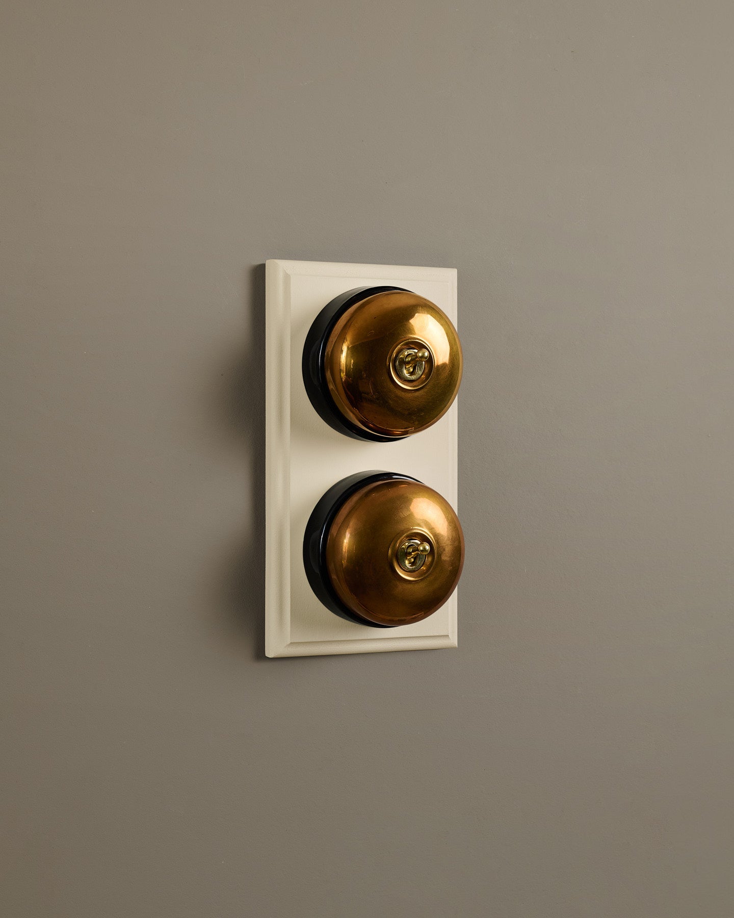 The Dolly Toggle Switch (2 Gang & Primed Maple Pattress) - Heirloom Brass with Black Base.