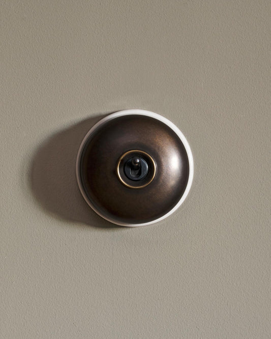 The Dolly Toggle Switch - Oxidised Brass, White Base, Single Way Retract