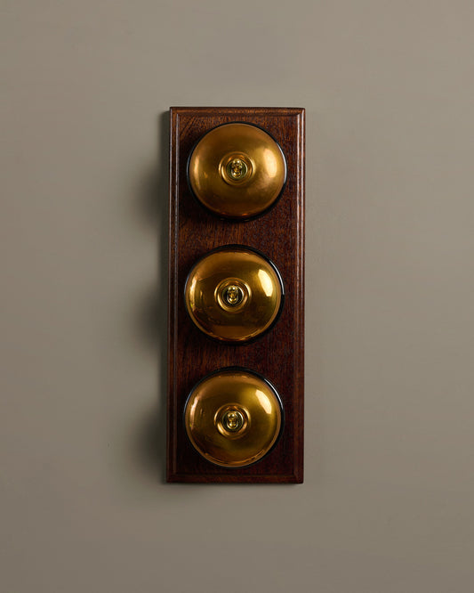 The Dolly Toggle Switch (3 Gang & Mahogany Finish Pattress) - Heirloom Brass with Black Base.