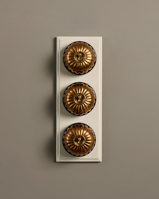 The Jelly Toggle Switch (3 Gang & Primed Maple Pattress) - Heirloom Brass with Black Base.