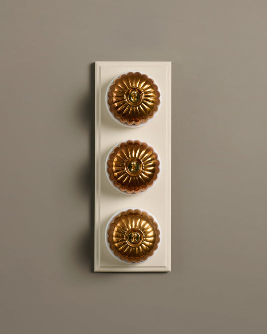 The Jelly Toggle Switch (3 Gang & Primed Maple Pattress) - Heirloom Brass with White Base.
