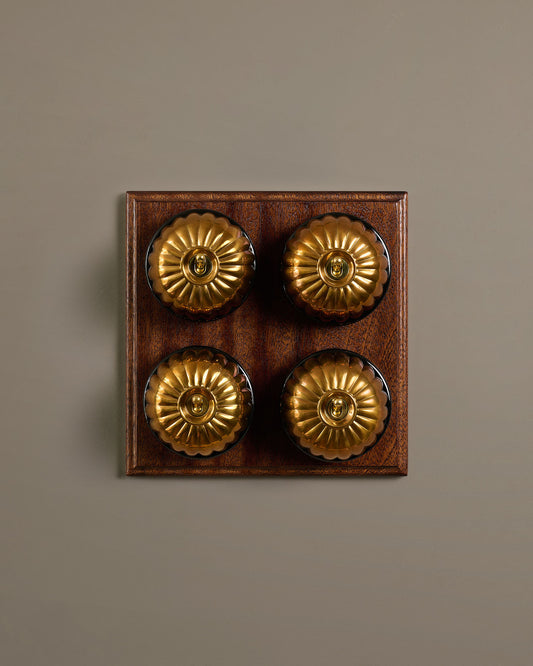 The Jelly Toggle Switch (4 Gang Bank & Mahogany Finish Pattress) - Heirloom Brass with Black Base.