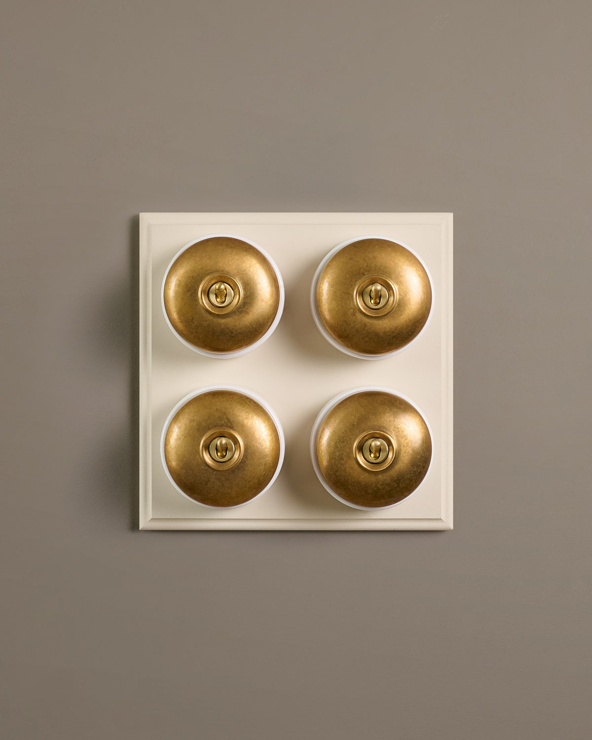 The Dolly Toggle Switch (4 Gang Bank & Primed Maple Pattress) - Aged Brass with White Base. TEST