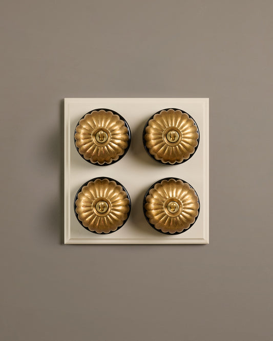 The Jelly Toggle Switch (4 Gang Bank & Primed Maple Pattress) - Aged Brass with Black Base.