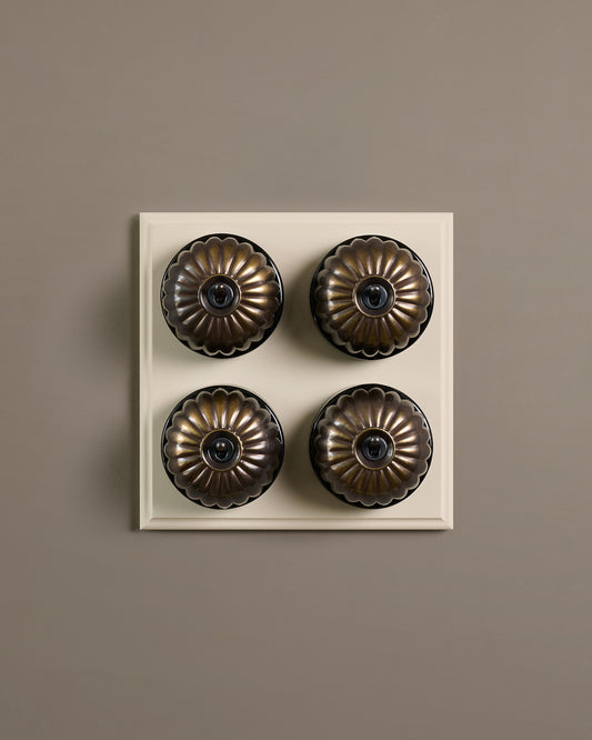 The Jelly Toggle Switch (4 Gang Bank & Primed Maple Pattress) - Oxidised Brass with Black Base.