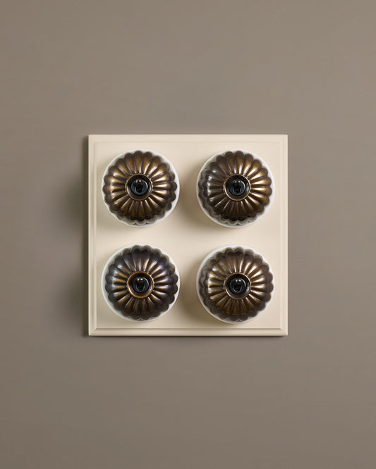 The Jelly Toggle Switch (4 Gang Bank & Primed Maple Pattress) - Oxidised Brass with White Base.