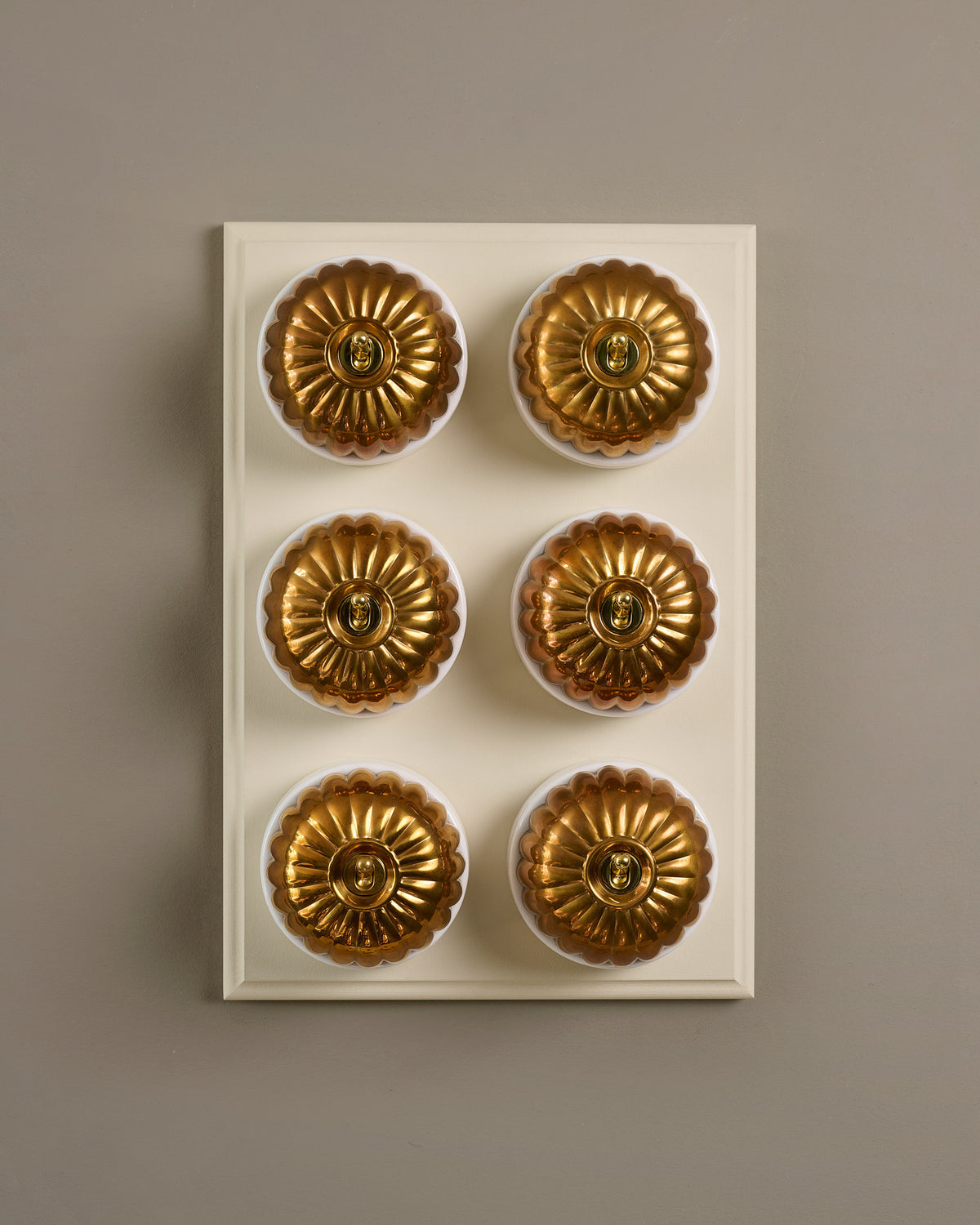 The Jelly Toggle Switch (6 Gang & Primed Maple Pattress) - Heirloom Brass with White Base. TEST