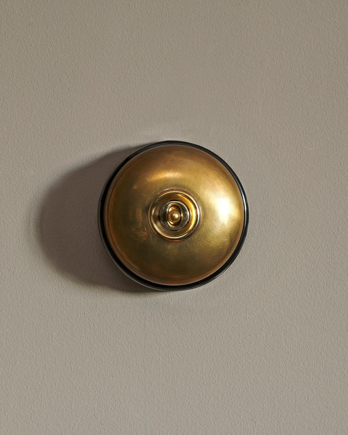 The Dolly Toggle Switch - Heirloom Brass, Black Base, Retract to Centre TEST