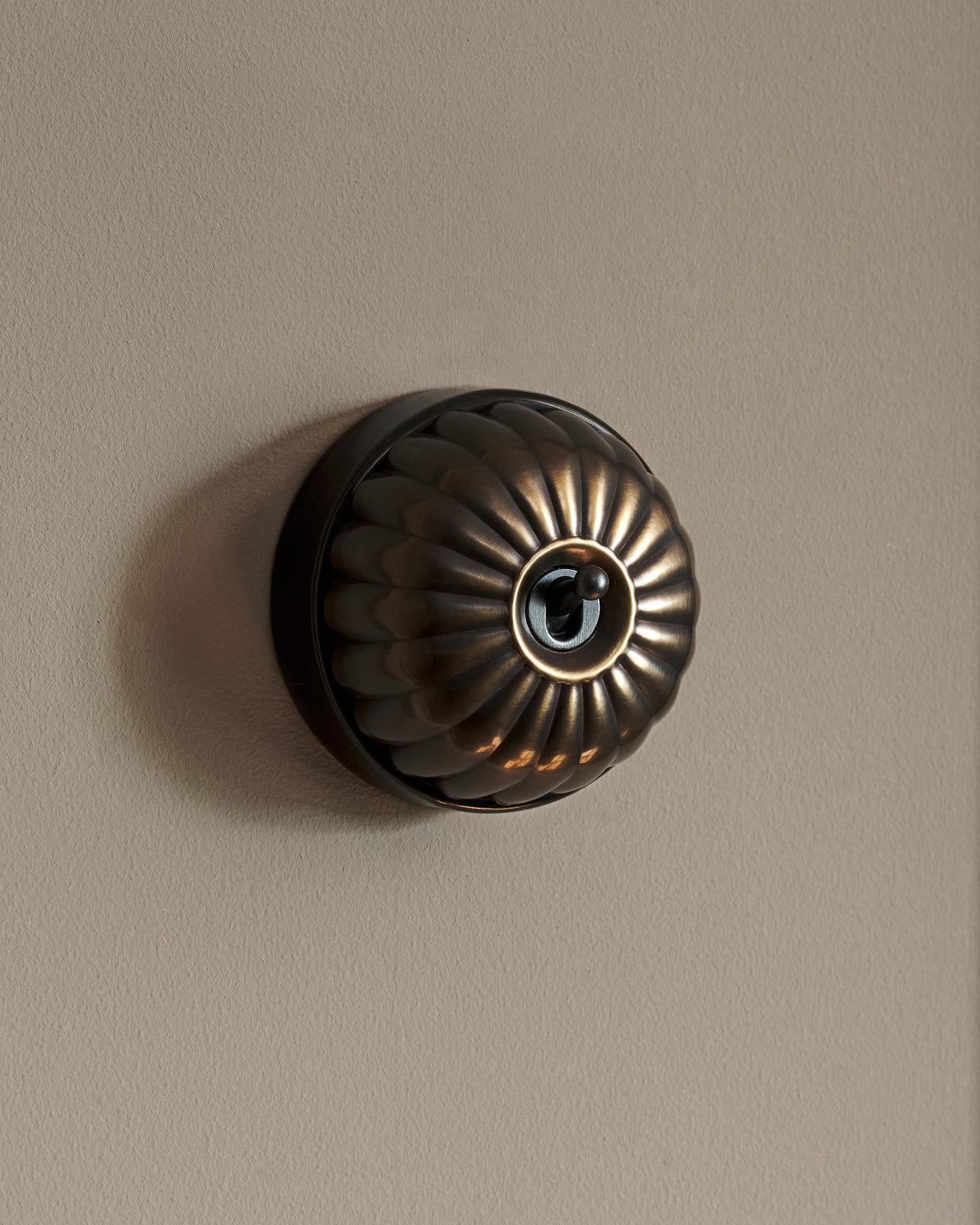 The Jelly Toggle Switch - Oxidised Brass, Black Base, Single Way Retract