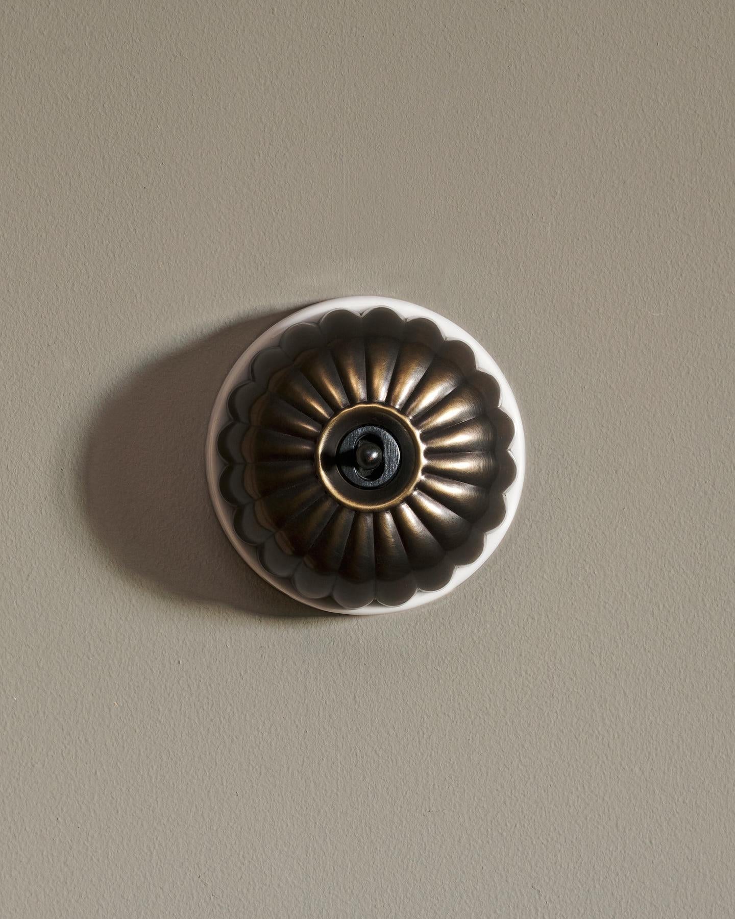 The Jelly Toggle Switch - Oxidised Brass, White Base, Retract to Centre