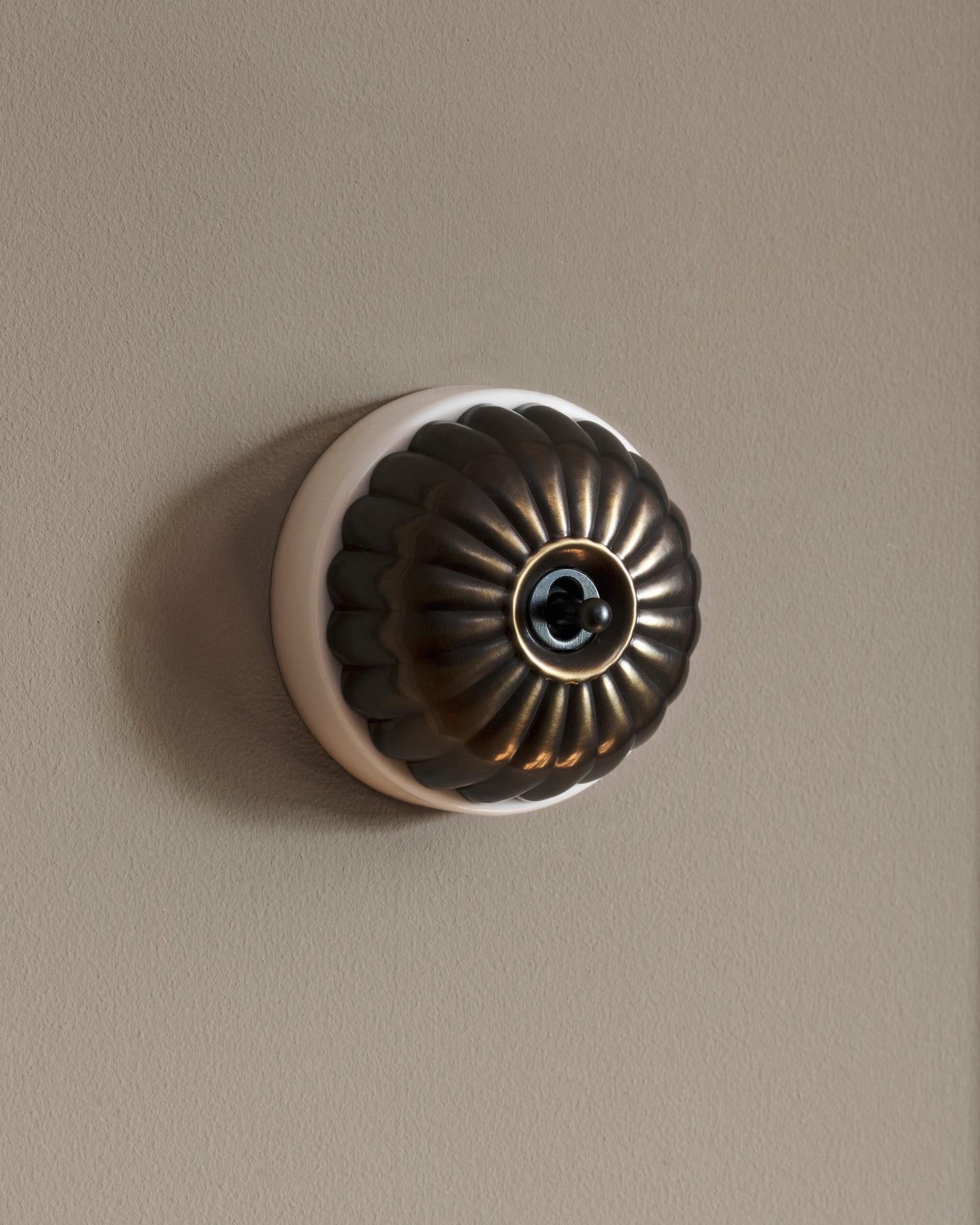 The Jelly Toggle Switch - Oxidised Brass, White Base, Retract to Centre