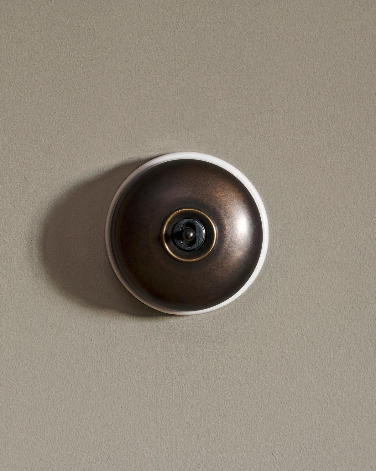 The Dolly Toggle Switch - Oxidised Brass, White Base, Retract to Centre TEST