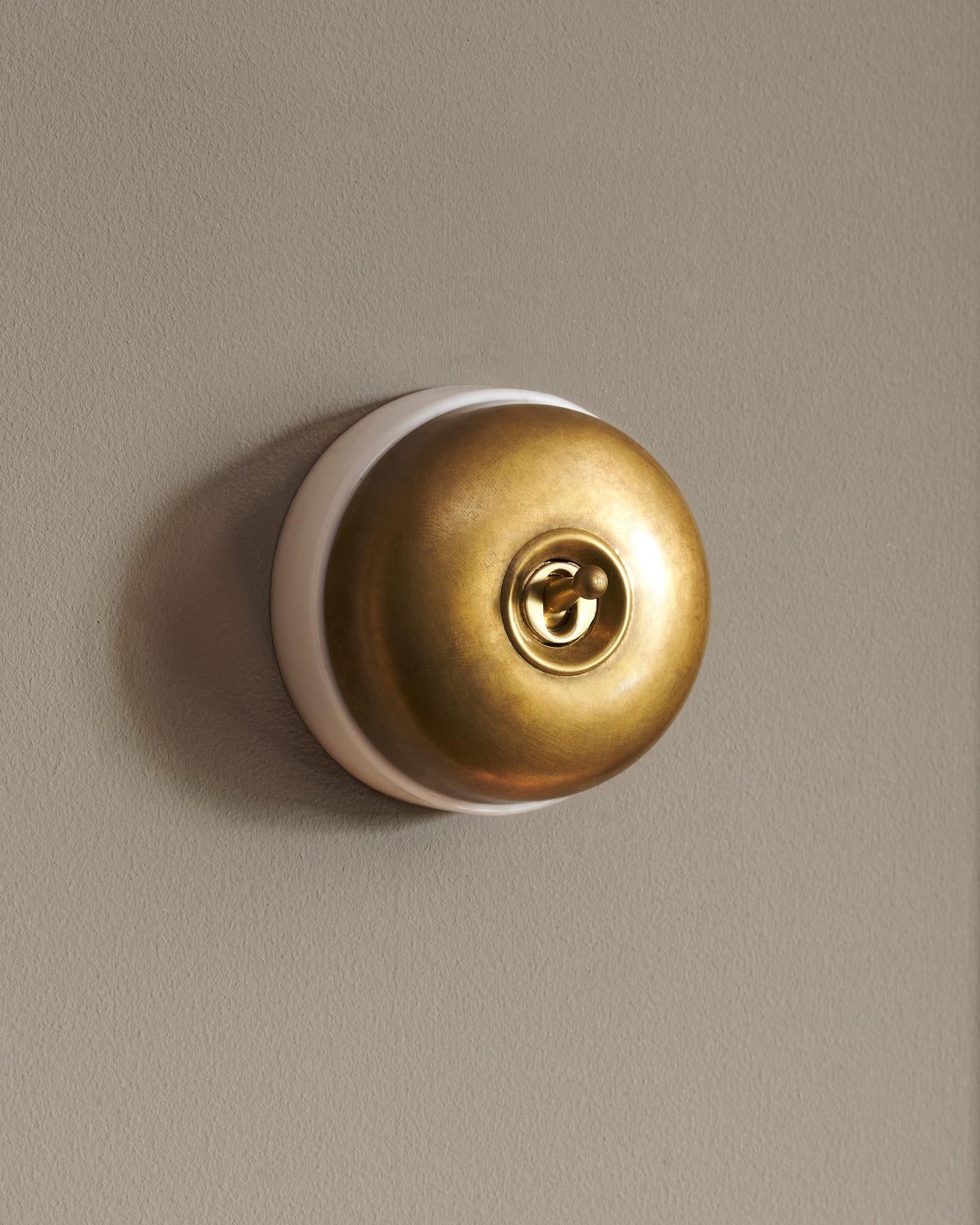 The Dolly Toggle Switch - Aged Brass, White Base, Intermediate