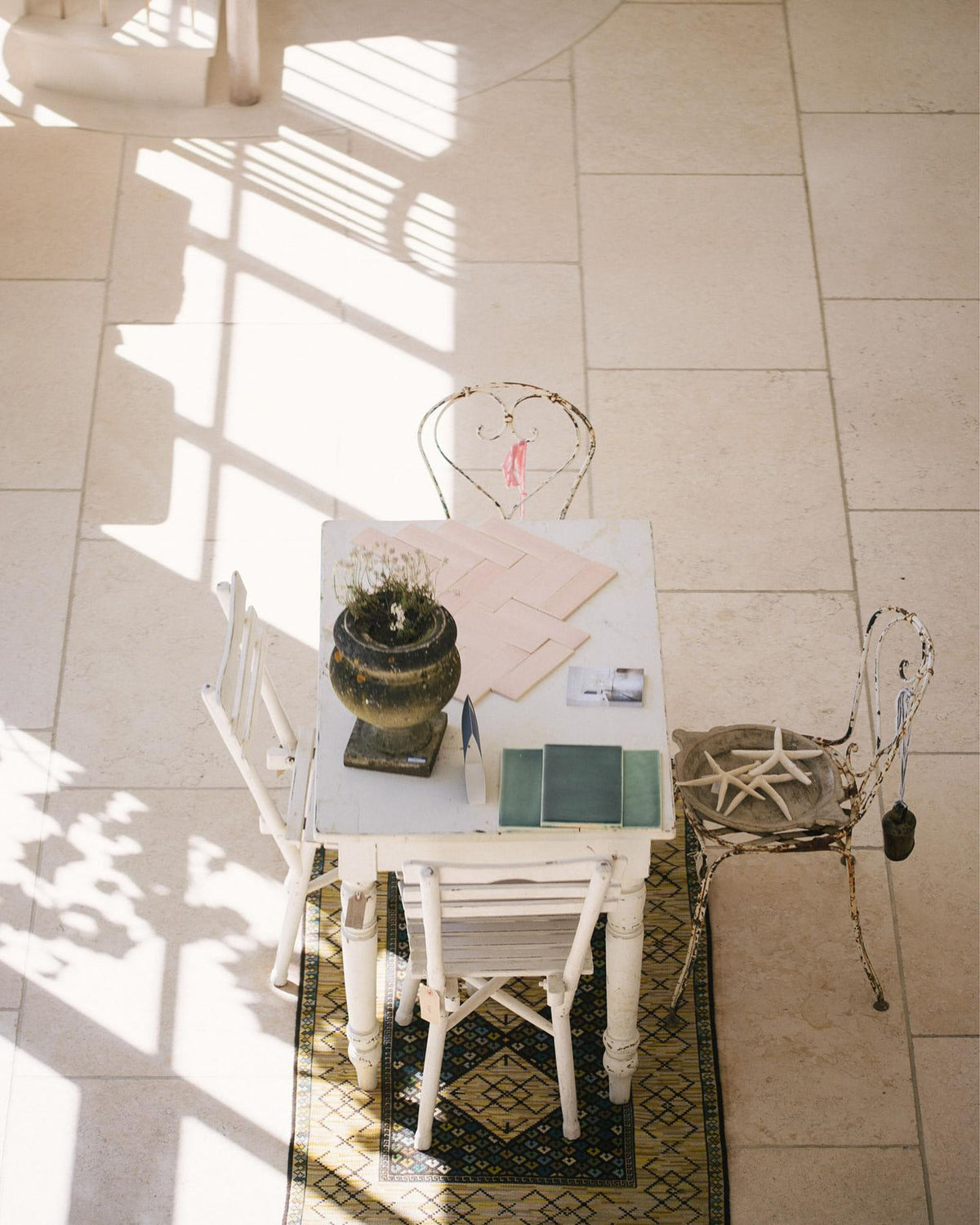 A close-up overhead view of Light Jerusalem Limestone flooring, showing the mottled cream colour and smooth texture. TEST