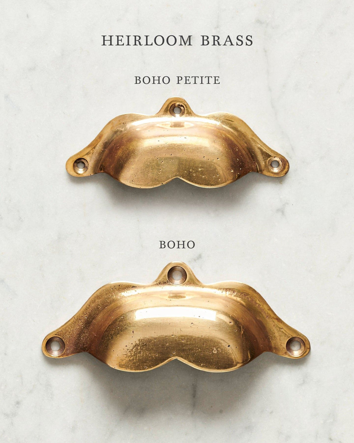Two bohemian-style cup handles for a kitchen cupboard or drawer with a warm burnished brass finish. There is a large and a small size. TEST