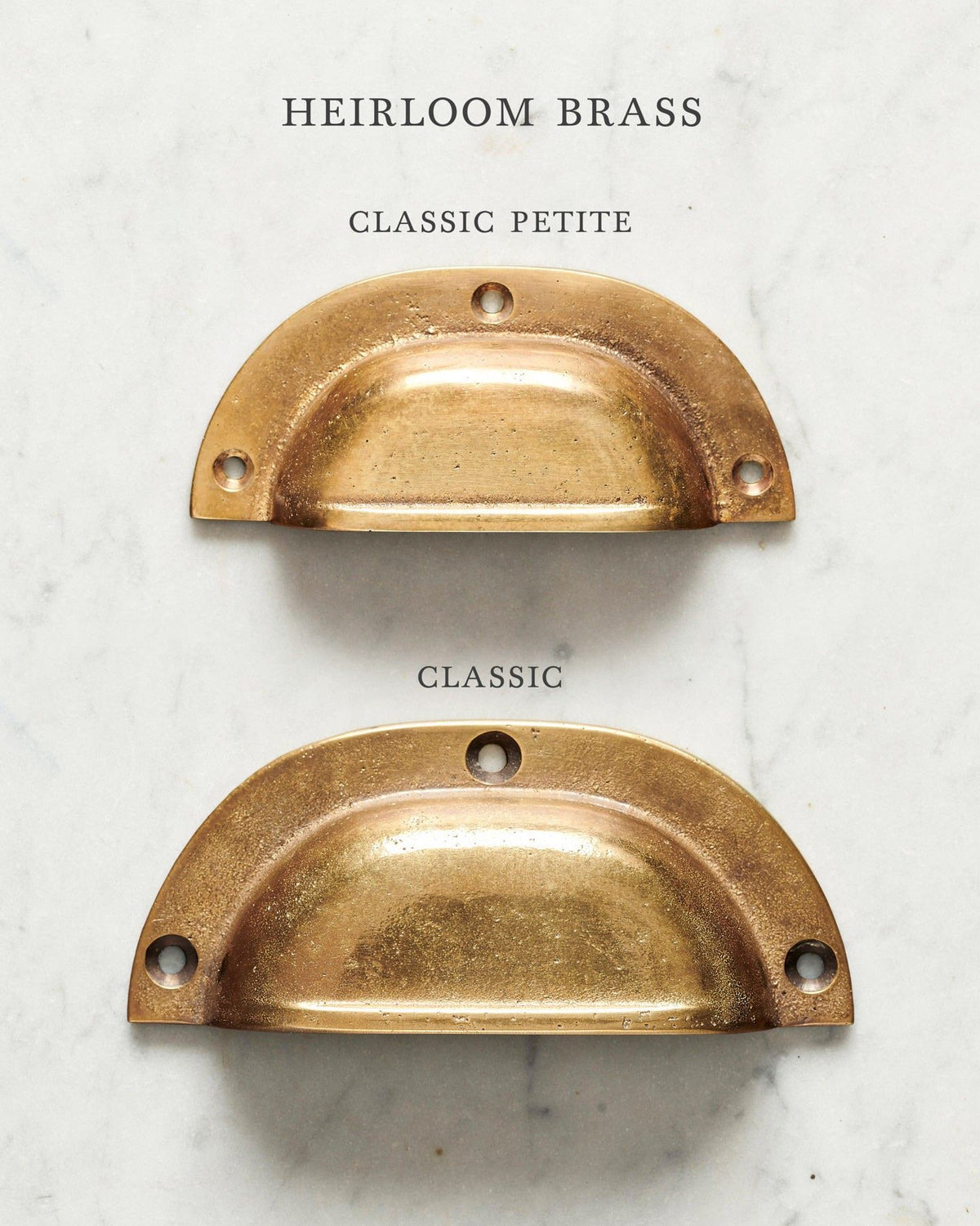 Two classic cup handles for a kitchen cupboard or drawer with a warm burnished brass finish. There is a large and a small size. TEST