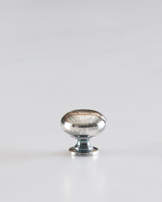 A 'Petite' classic knob for a kitchen cupboard or drawer with a tarnished silver finish.