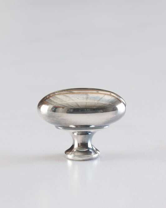 A 'Medium' oval-shaped knob for a kitchen cupboard or drawer with a tarnished silver finish.