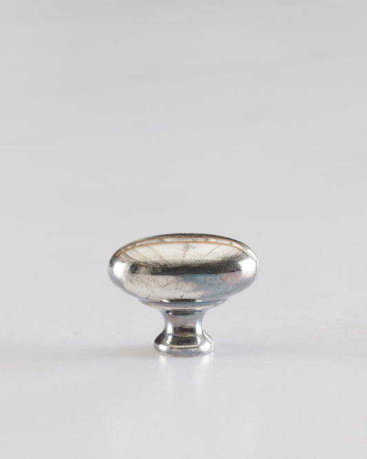 A 'Small' oval-shaped knob for a kitchen cupboard or drawer with a tarnished silver finish.