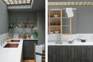 A chic and simple Sebastian Cox basement kitchen features a long sink run with two sets of copper sinks, aged brass Mayan taps, a Carrara marble worktop, glazed wall cupboards, a large kitchen island with a gas cooker, a copper worktop, and a breakfast nook. This kitchen creates a cool and atmospheric space, beautifully decorated with luscious green house plants, vintage items, drinking glasses, a plumber’s stool, and a simple pendant light.