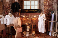 A closer look at the Grand Tour library lamp and the plug-in porcelain beaker lamp as part of the handsome range of oak furniture and lighting from the deVOL Haberdasher’s collection. Adorned with vintage furniture and items, dressmaker mannequins, and 1900s tailor tools, this space creates a beautiful homage to the English gentlemen’s haberdashery inspiration in a bricked wall showroom.