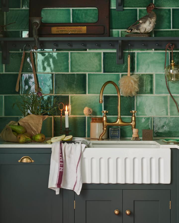 A detailed close-up of a ‘Shaker’ kitchen, painted in ‘Bakehouse Green’ and fitted with glossy ‘Emerald Green Tiles’. This kitchen is recognisable from deVOL’s TV Show ‘For the Love of Kitchens’, where you’re taken into the workshop to see how some of our products are made.