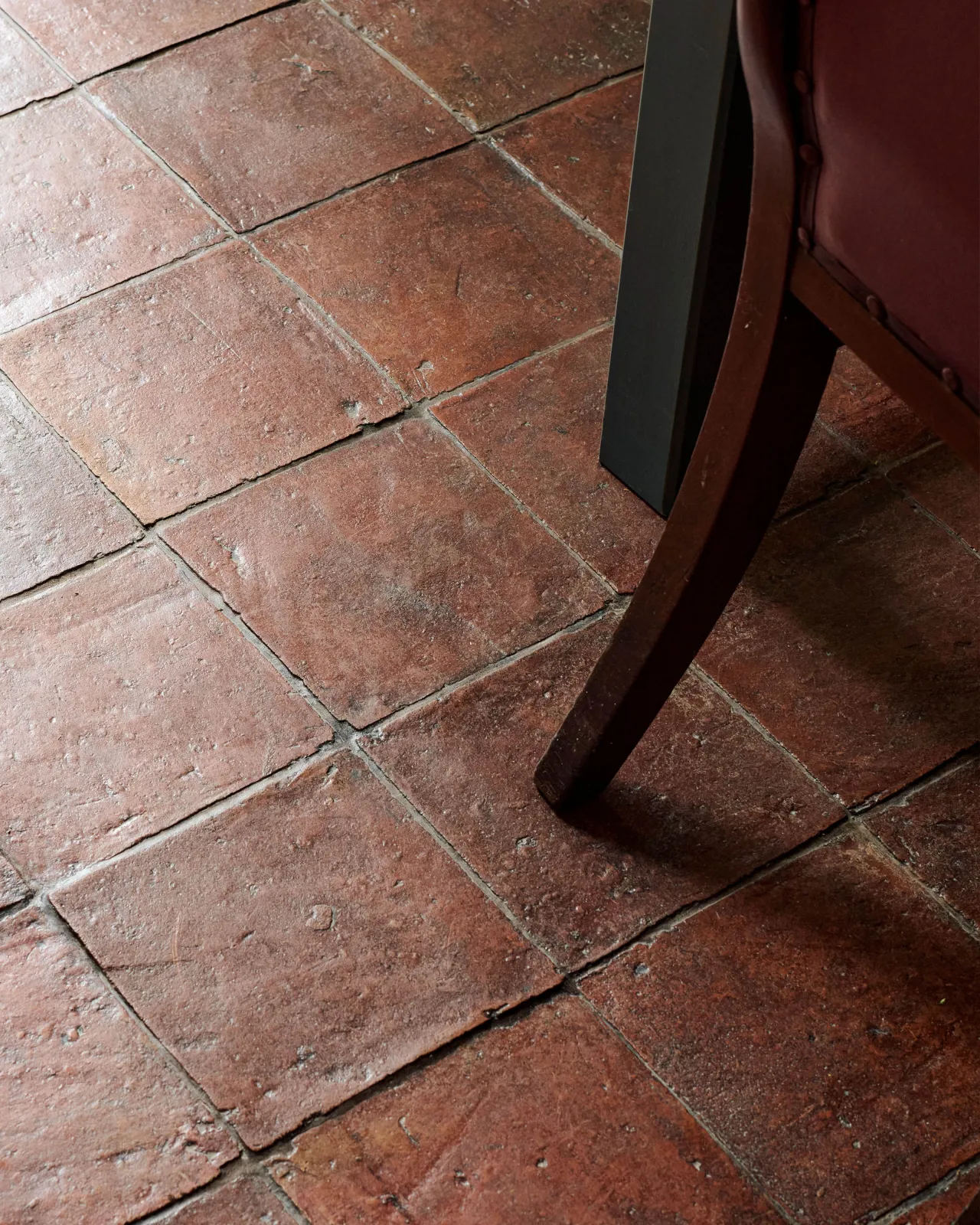 Aged terracotta flooring.