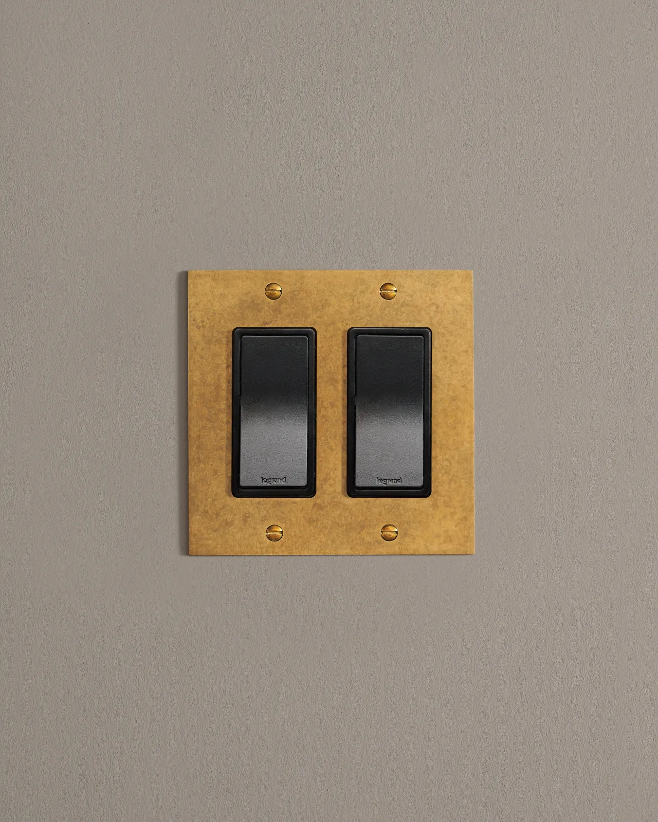 a front on shot of the rocket switch on an aged brass plate.