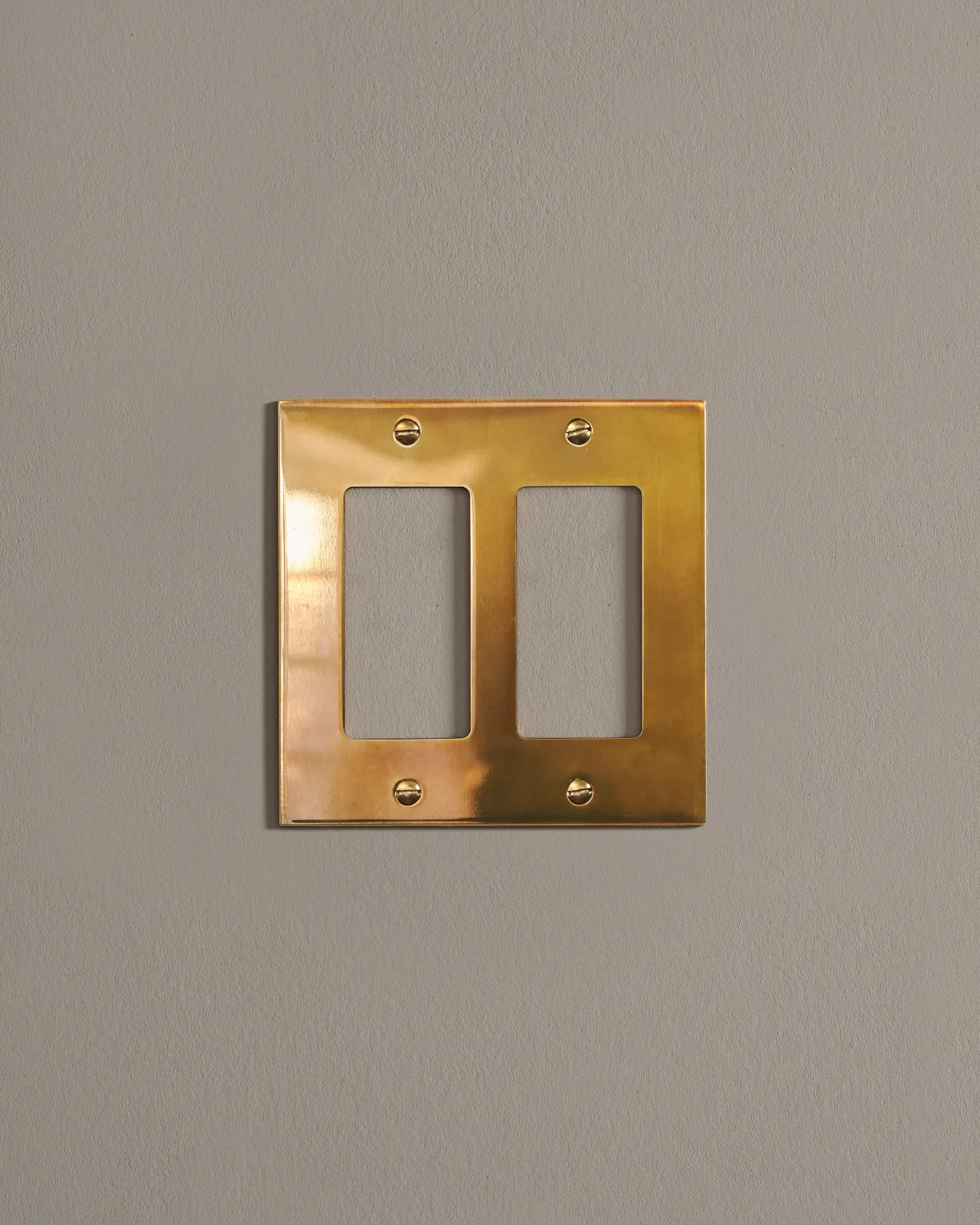 a front on shot of the decora cover plate in heirloom brass.
