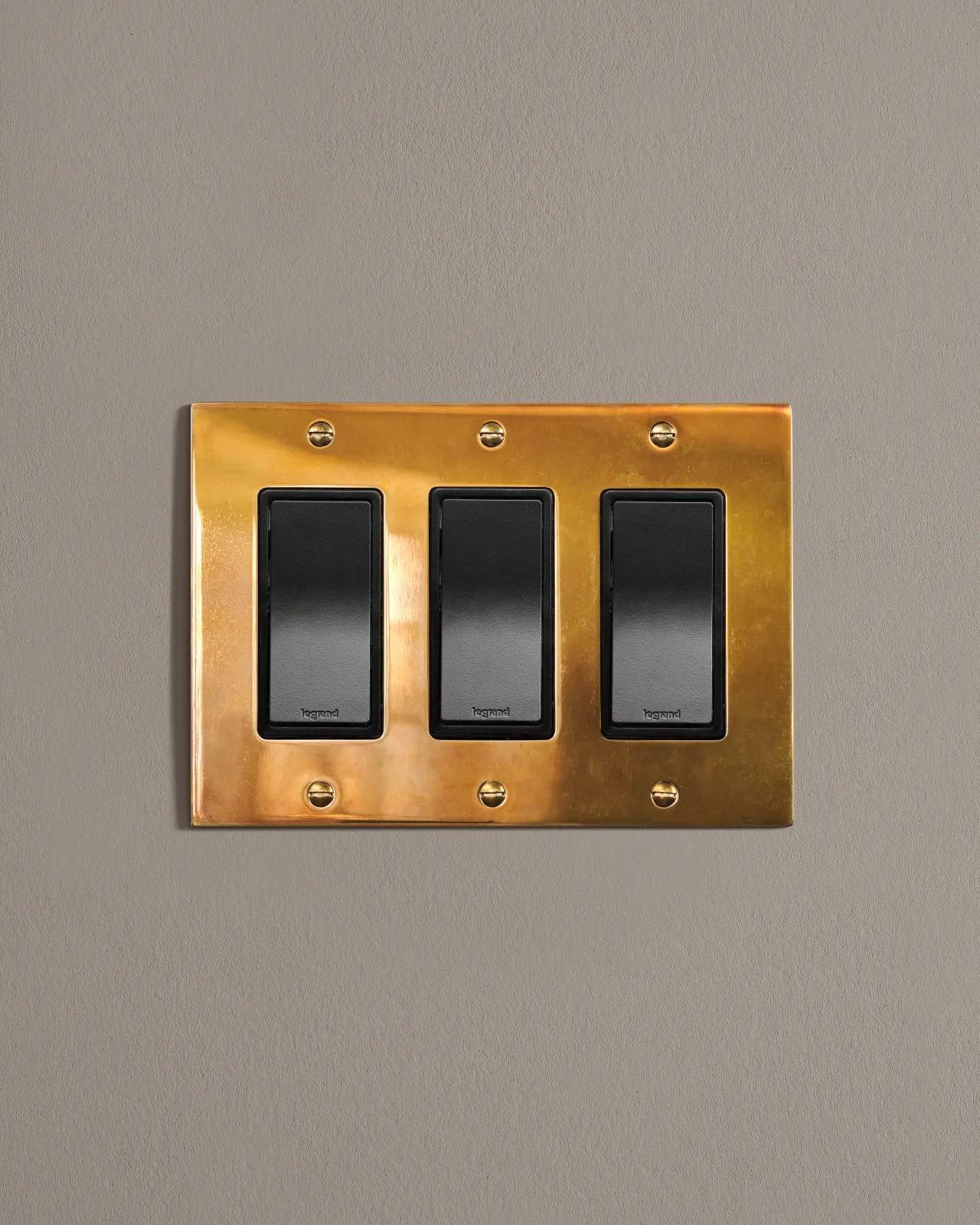 a front on shot of the rocker switch on an heirloom brass plate.