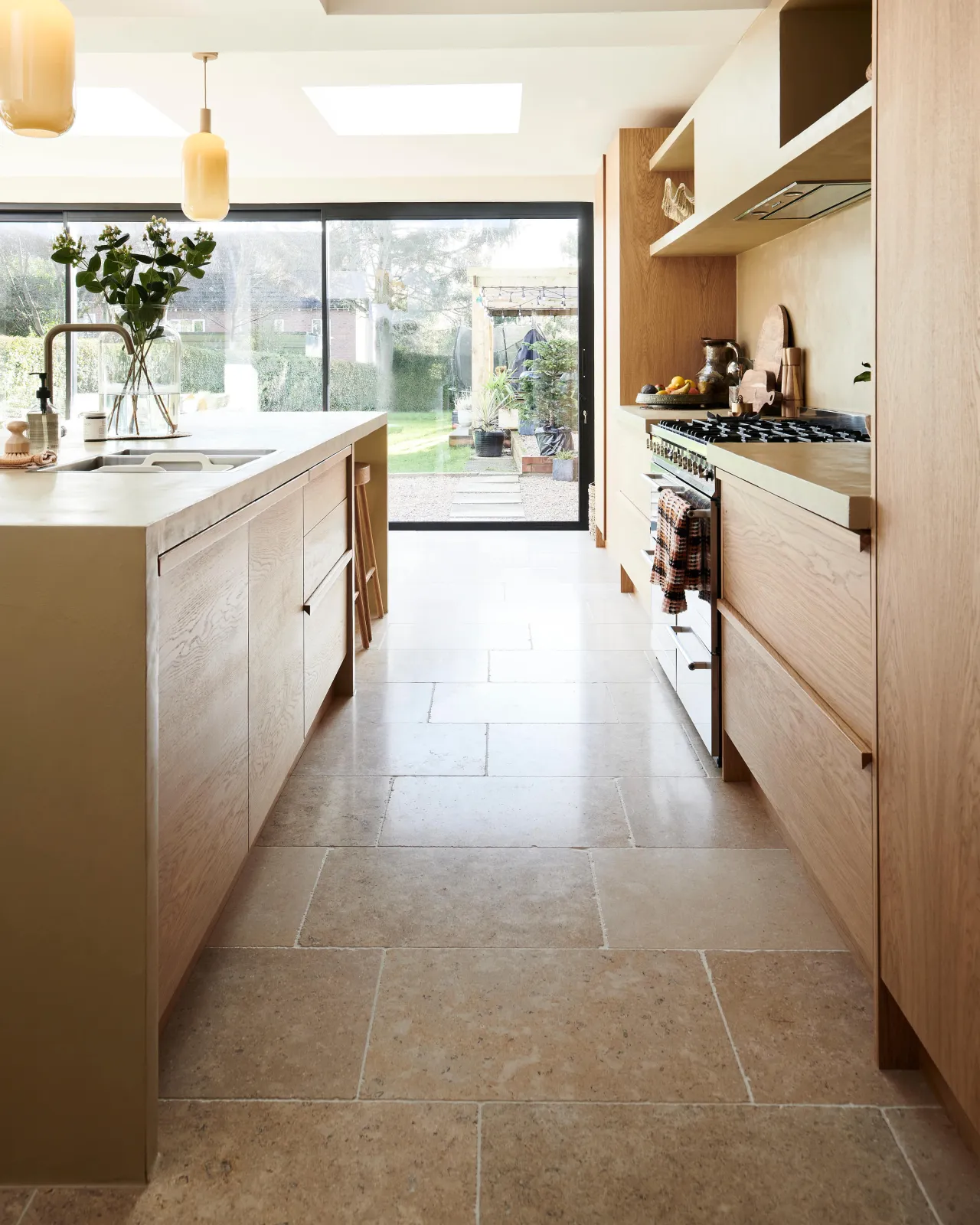 a kitchen lifestyle image of the dijon tumbled limestone flooring.
