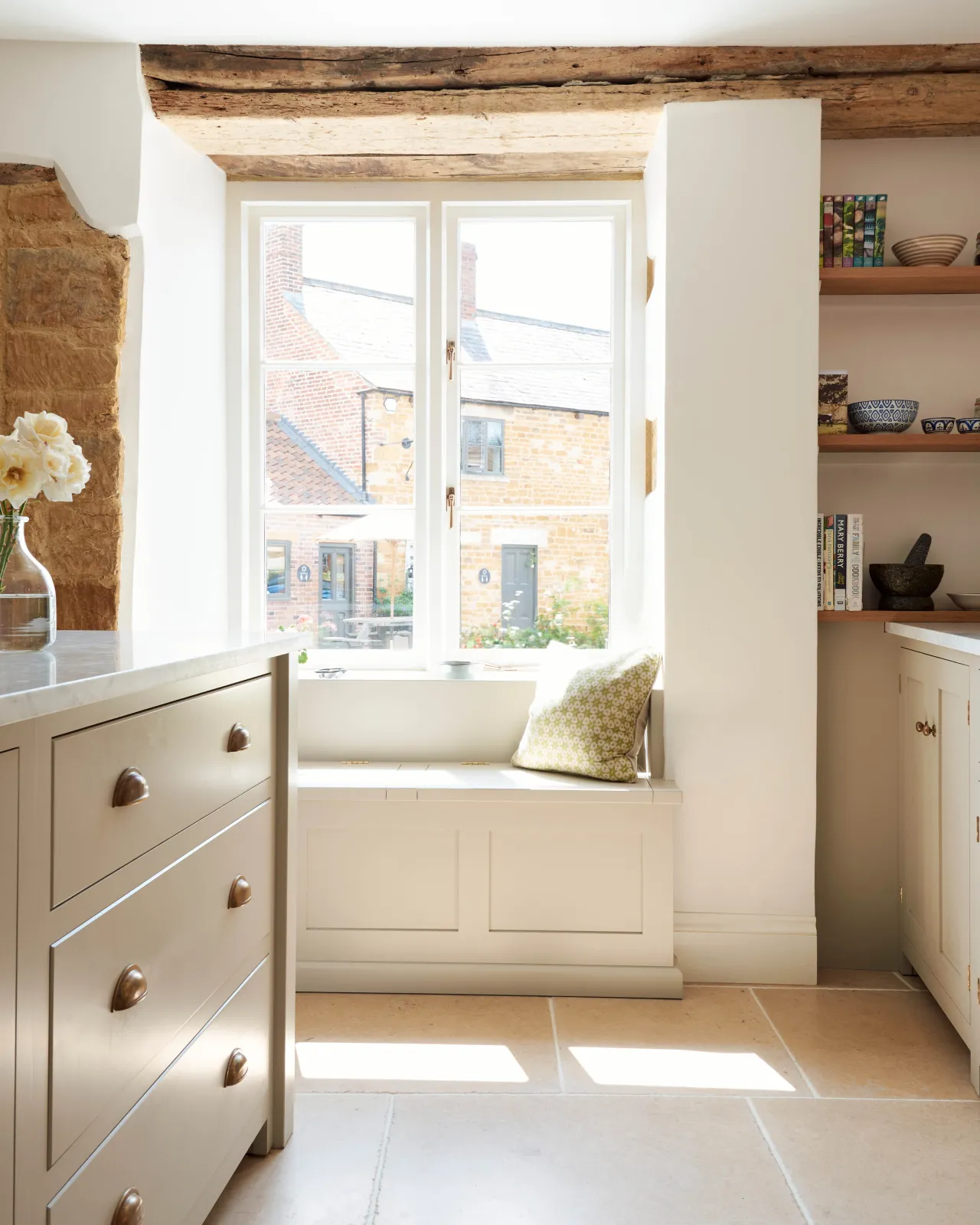 Vintage Bronze Limestone flooring in front of a cottage window.