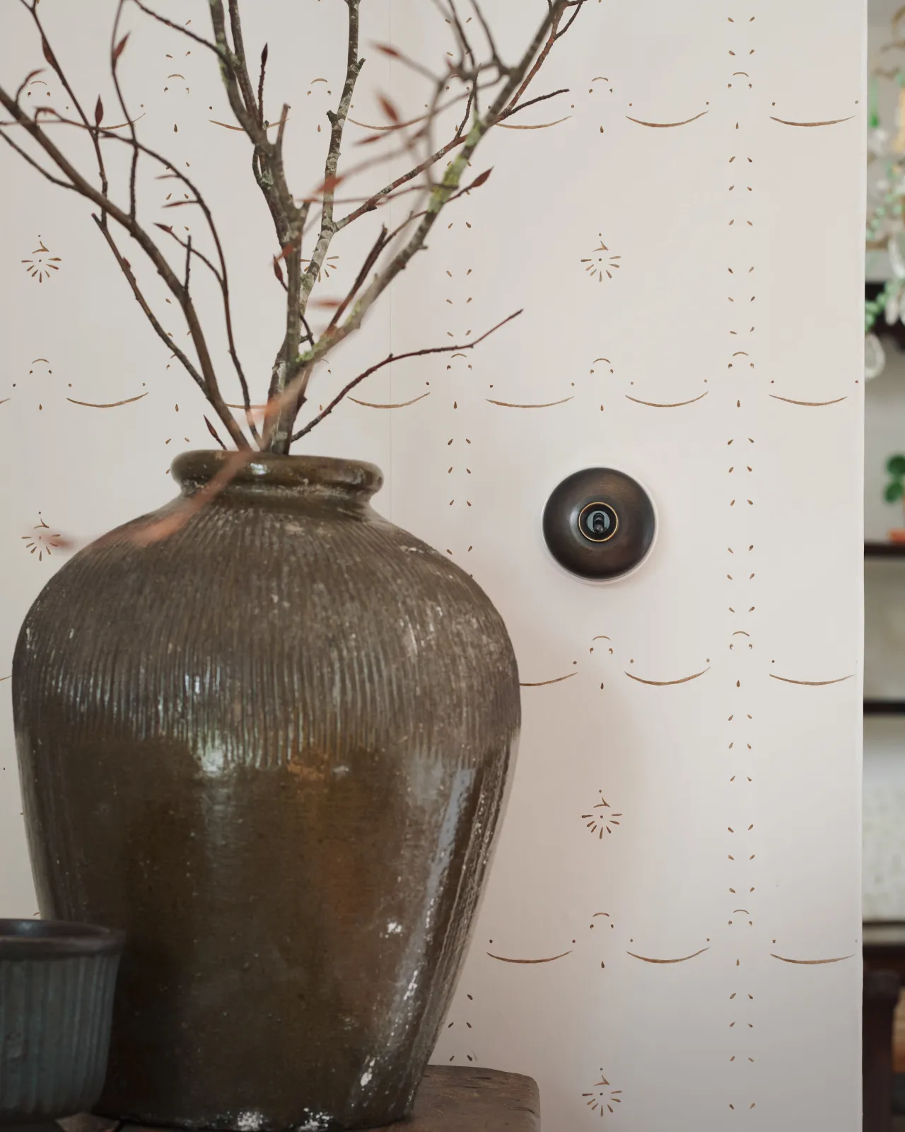 A deVOL Oxidised Brass Dolly Switch with white base fitted to a light and airy room.
