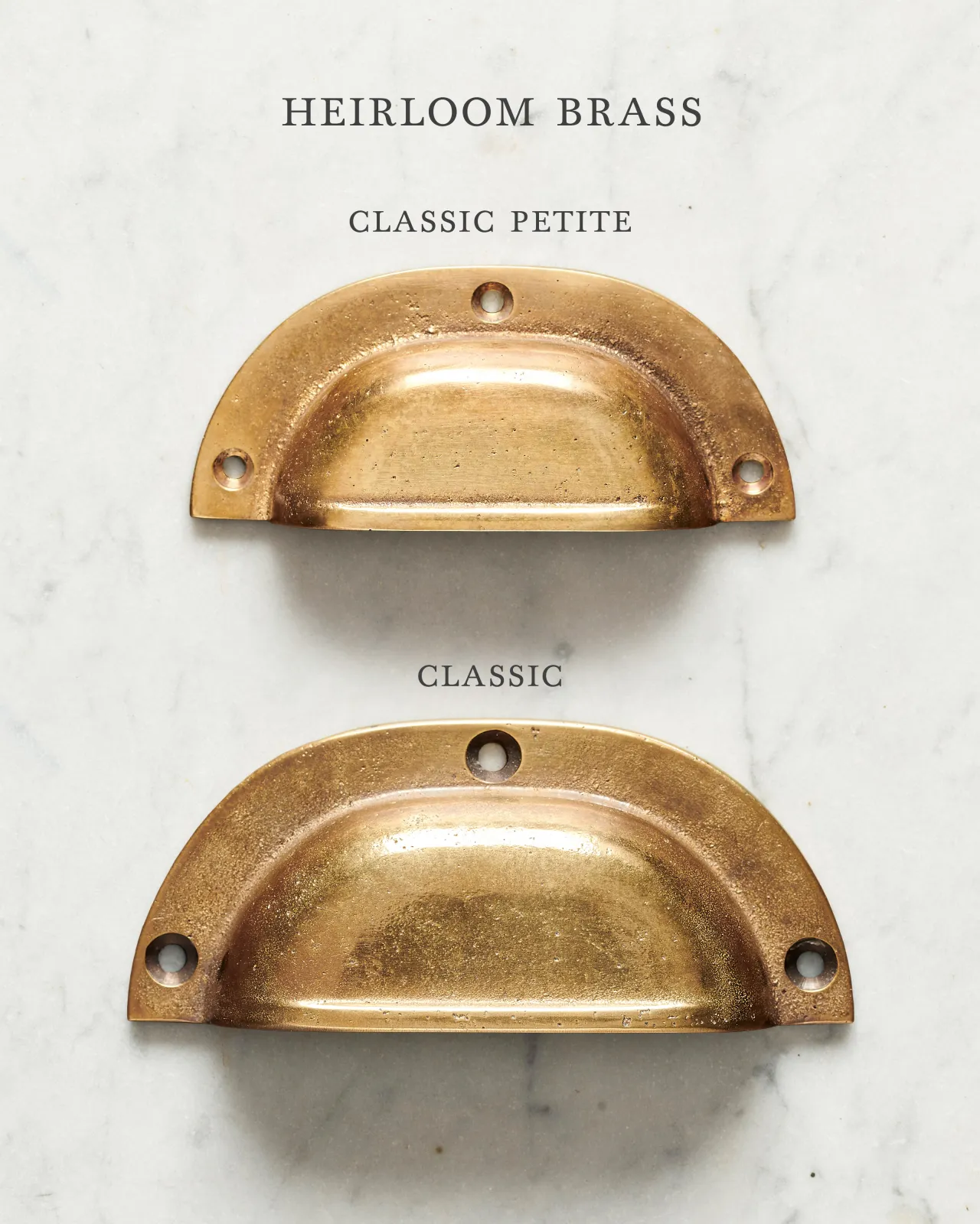 Two classic cup handles for a kitchen cupboard or drawer with a warm burnished brass finish. There is a large and a small size.