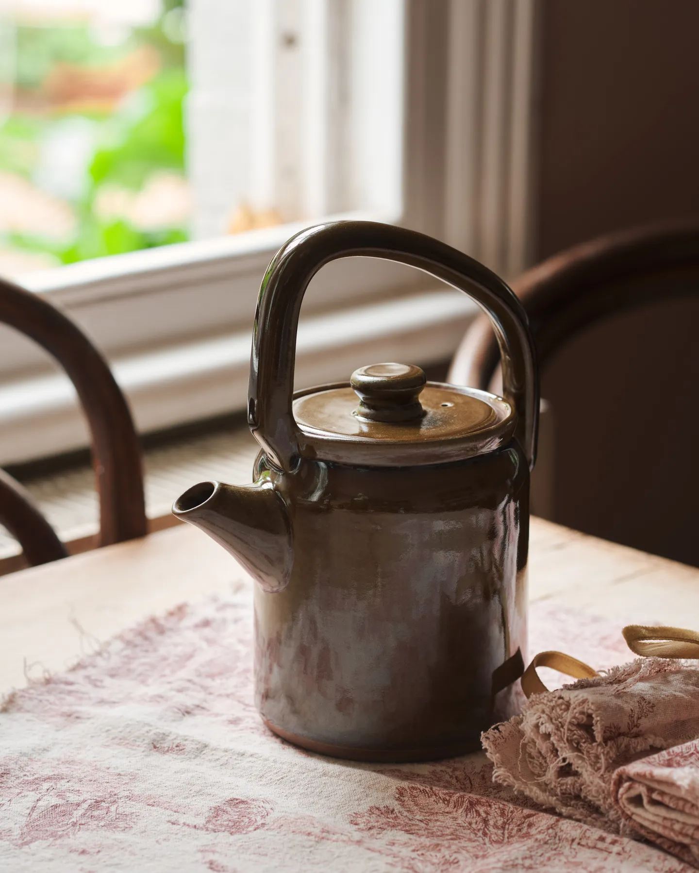 A smooth, glossy ‘Amber Glaze Teapot’ is the feature of this image.