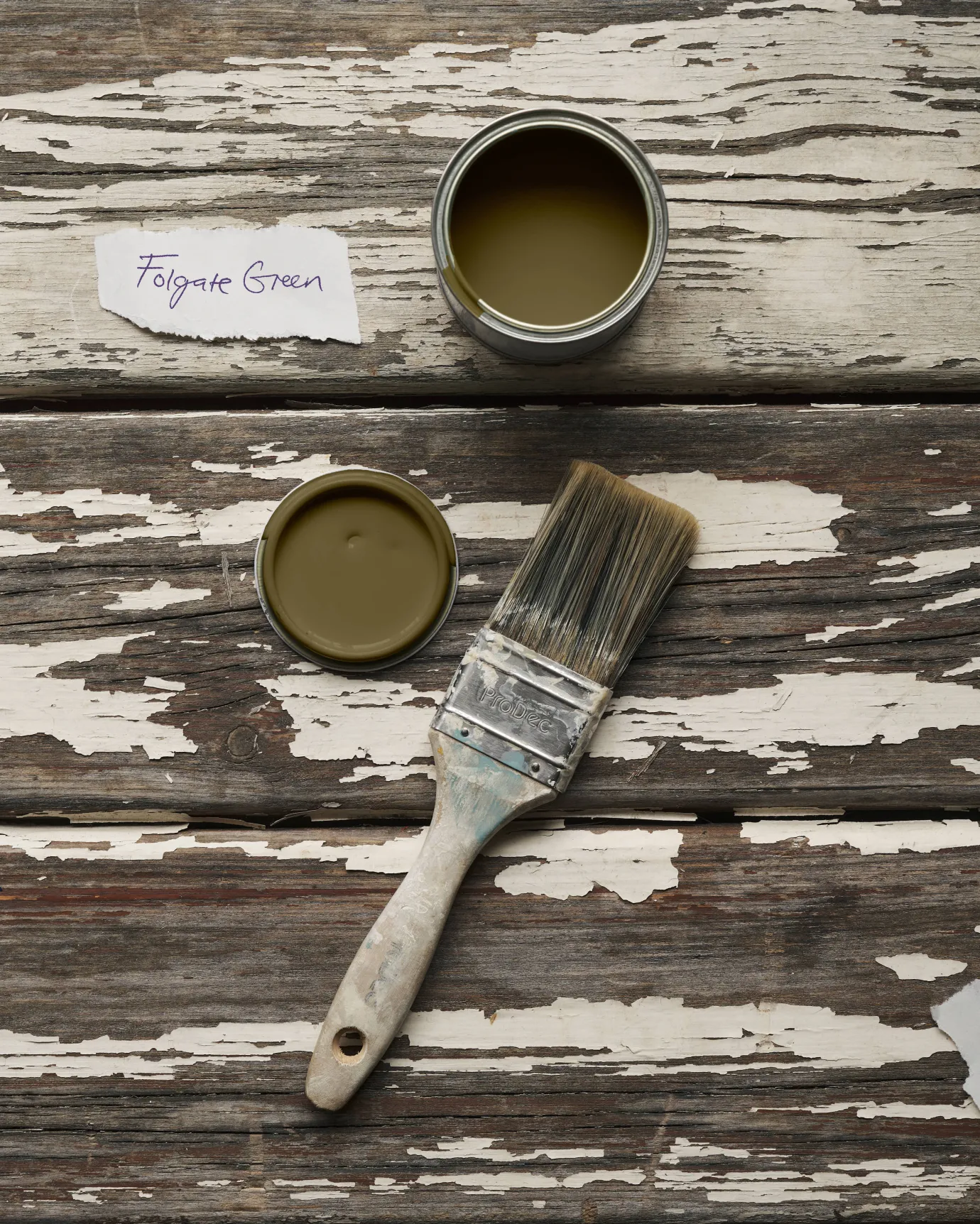 a sample pot of a yellow-ish dark green